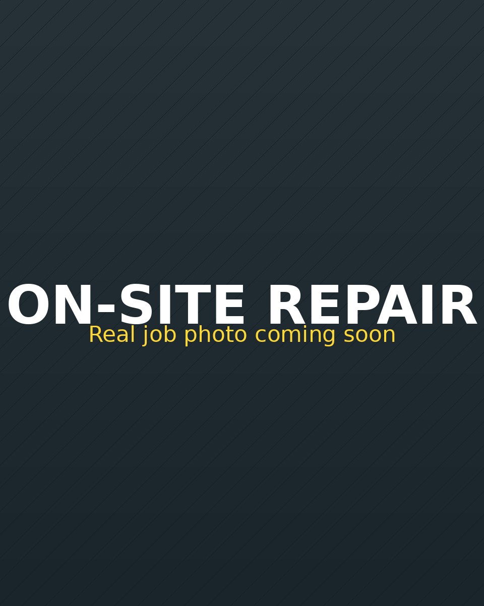 Mobile mechanic repairing a car brake in a Jacksonville driveway with service van behind